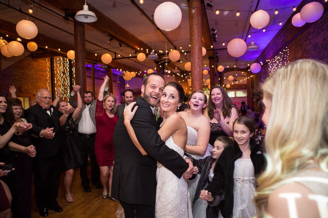 bride and groom on dance floor at their city art wedding reception